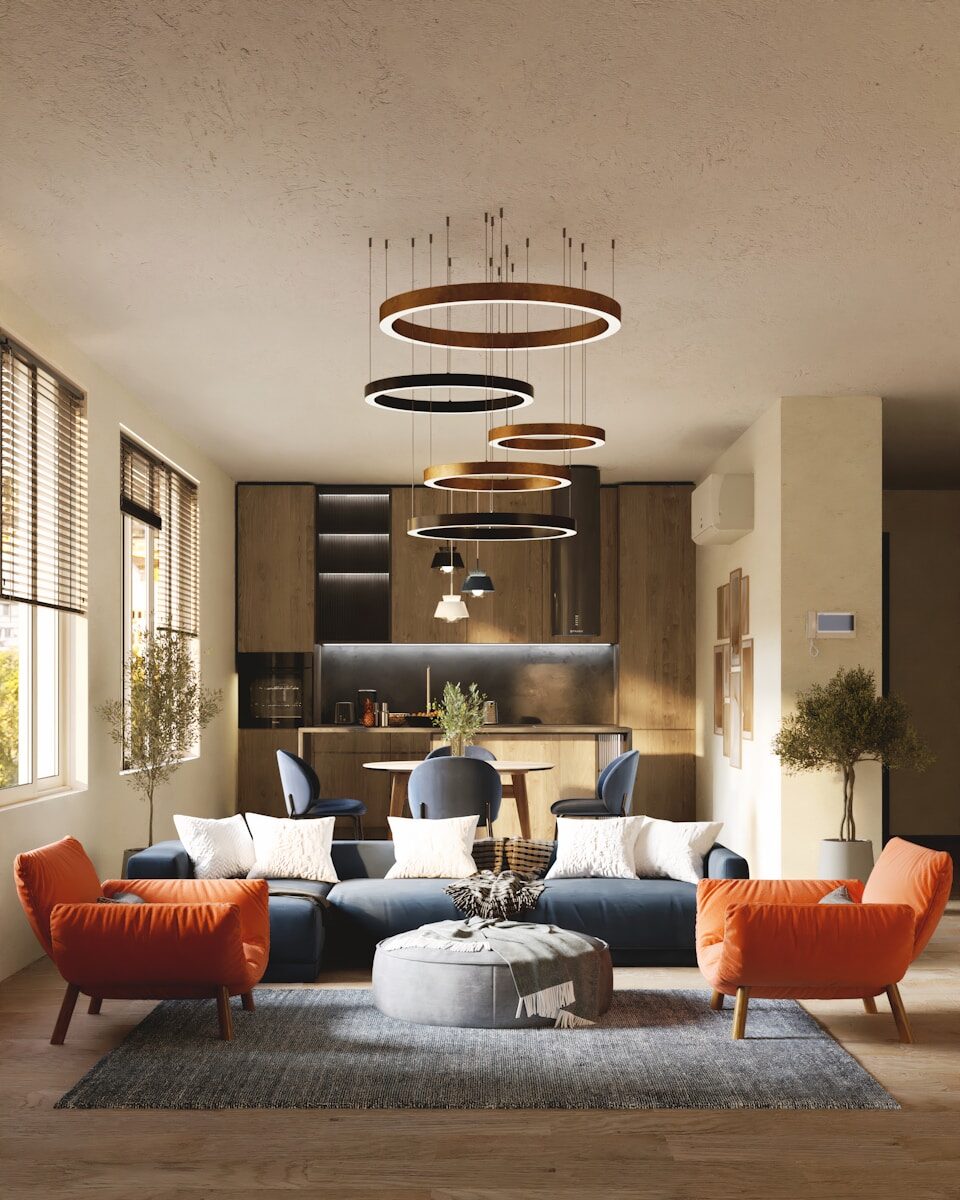 Photo by Taylor Flowe a living room filled with furniture and lots of windows